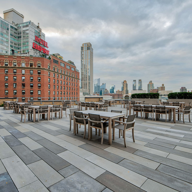 One Lincoln Plaza - Community Lounge Area with Tables and Chairs