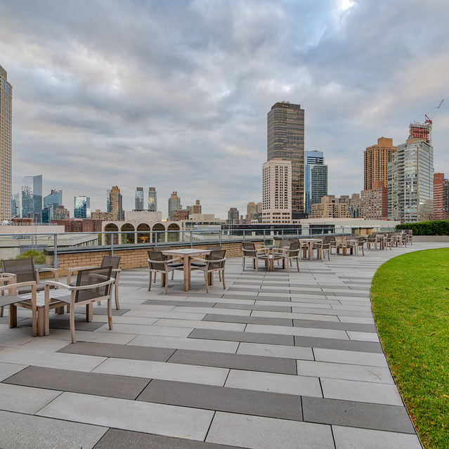 One Lincoln Plaza - Community Lounge Area with Tables and Chairs